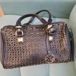 Black leather bag MK carved